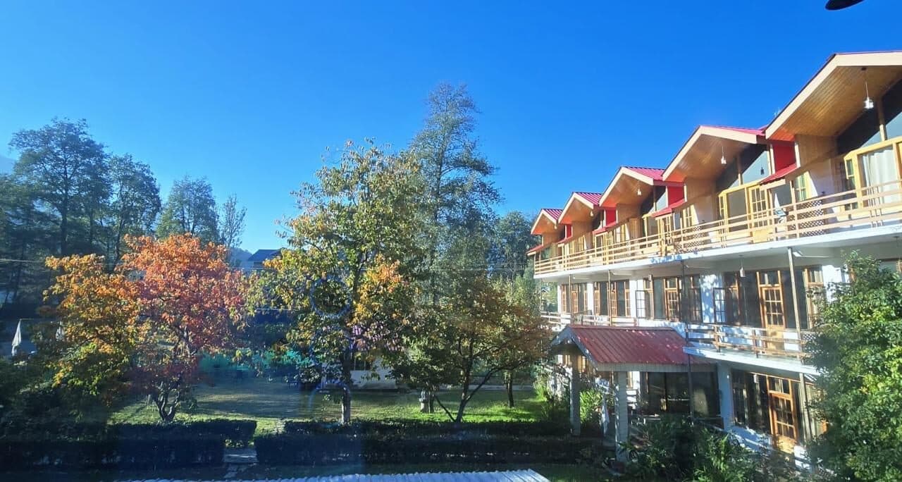 The farmstead building and garden in the morning light