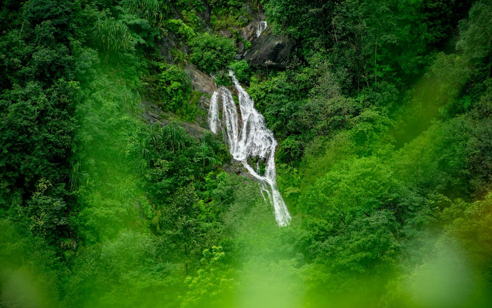 Jana waterfall dropping through deodar forest above the wooden dhabas near Naggar, Kullu valley